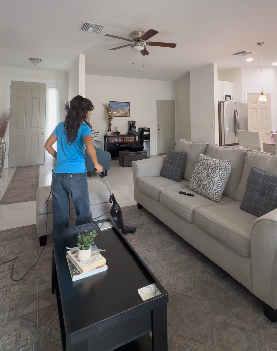 cleaning team vacuuming modern home interior